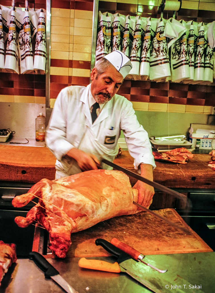 Butcher Separates Lamb Carcass
