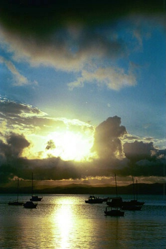 Sailboats watch sunset