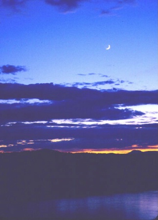 Moon at sunset over water