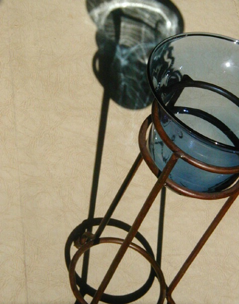 Shadows and reflection on dish with stand