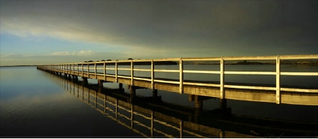 Coming of a Storm by the Lake Pier