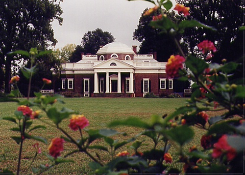 Monticello framed by foliage.