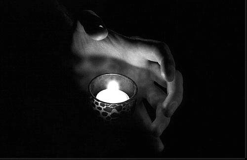 Candle and Hand