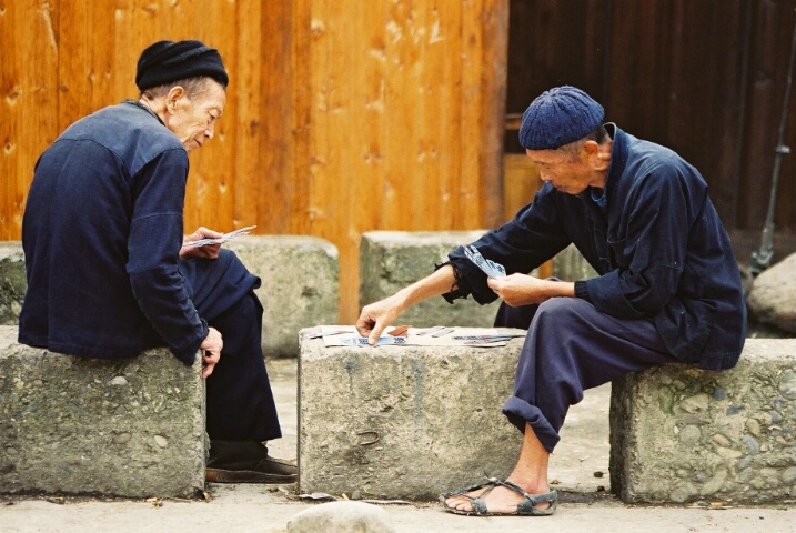 Elderly men playing cards