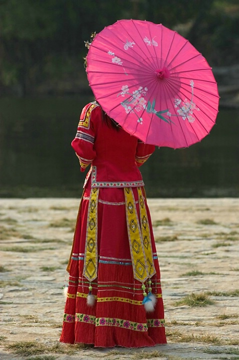 *Woman in traditional costume, Yangshou, China