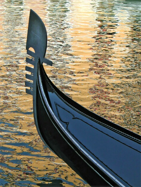 Gondola on golden reflections