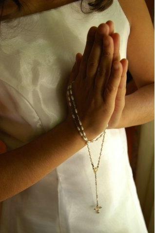 Hands in Prayer with a Rosary