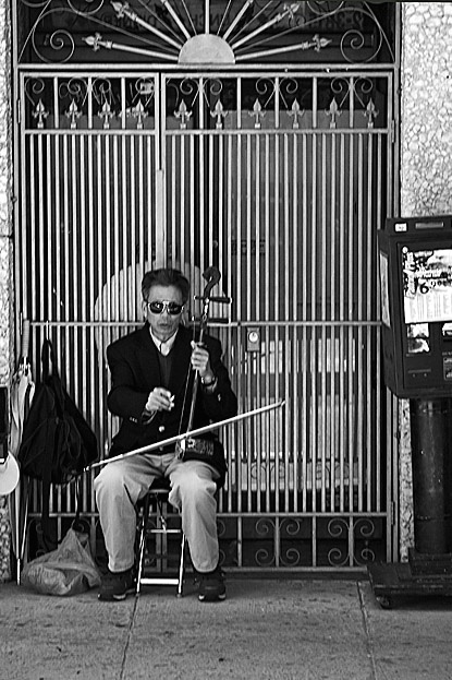 Street Musician in Chinatown - ID: 2430307 © John D. Jones