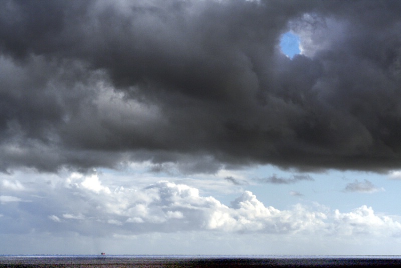 Blue Hole in the Sky and Red Ship on the Sea