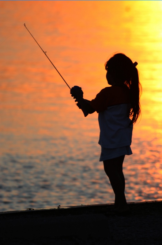 fishing at sunset