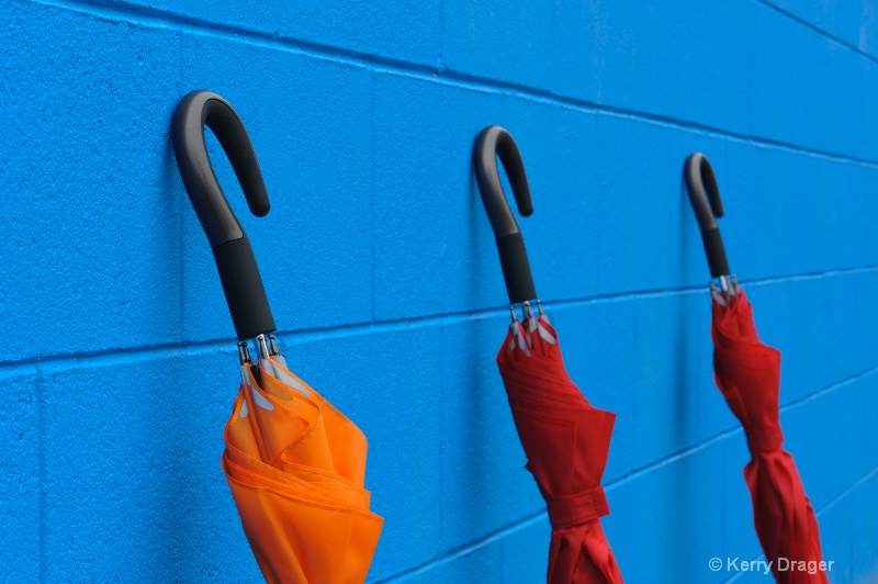 Umbrellas & Blue Wall