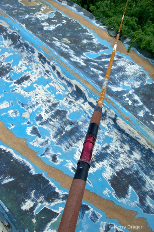Old Multi-Painted Boat & Fishing Pole
