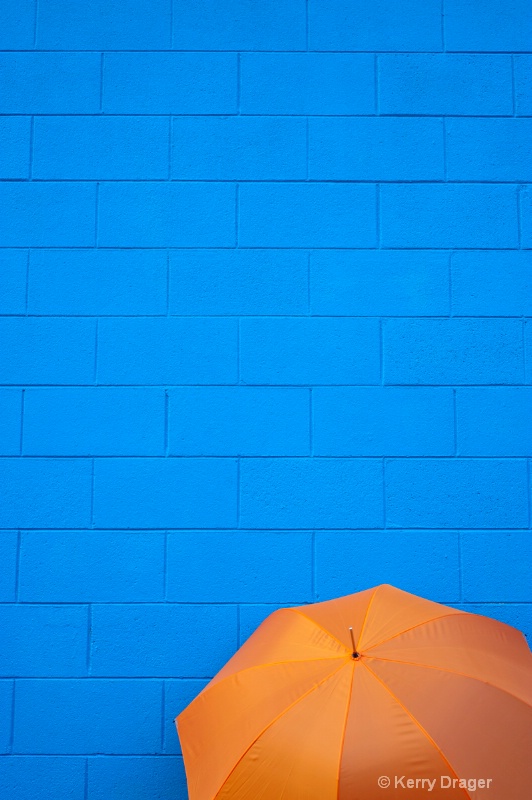 Orange Umbrella and Blue Wall