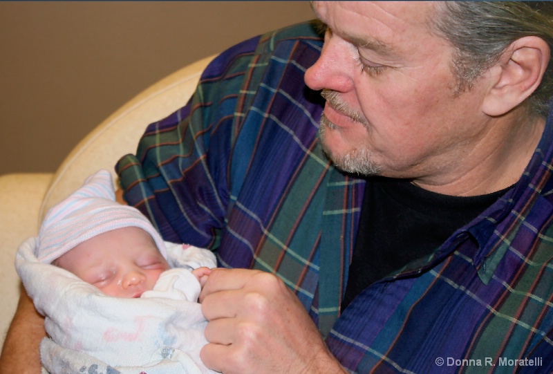 Proud grandpa with his first grandbaby