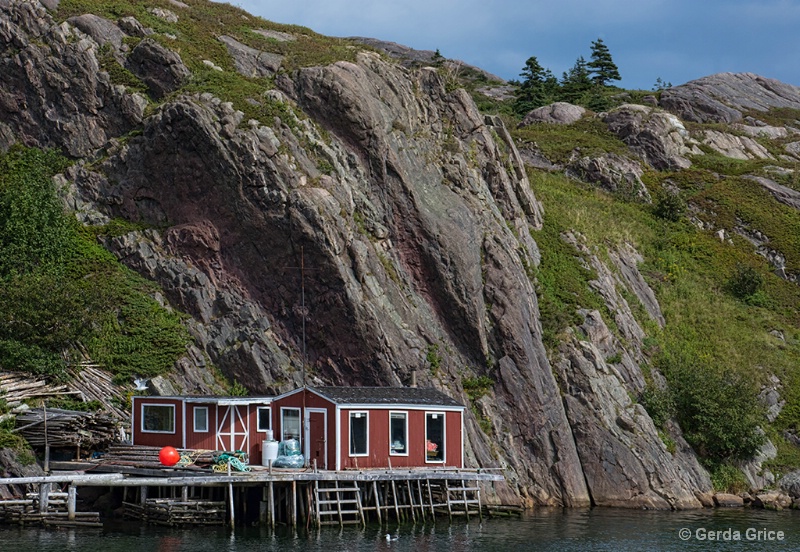 Fishing Stage at Foot of Cliff