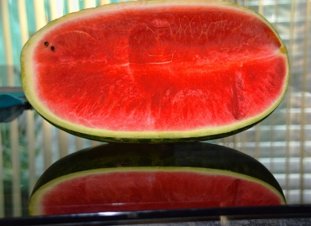 A WATERMELON AND ITS REFLECTION