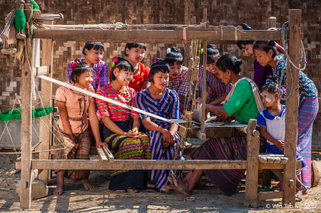 Weaving with wooden loom at village