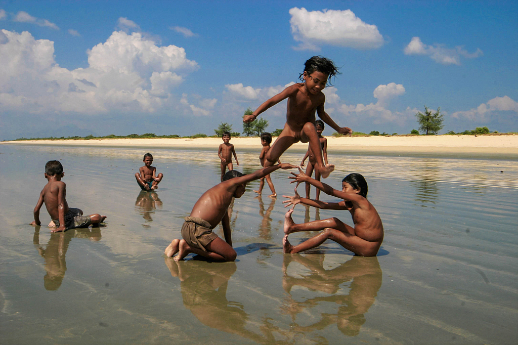 Fishermen"s Children playing on the beach 2