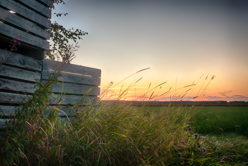 Sunset Behind Old Wooden Crates