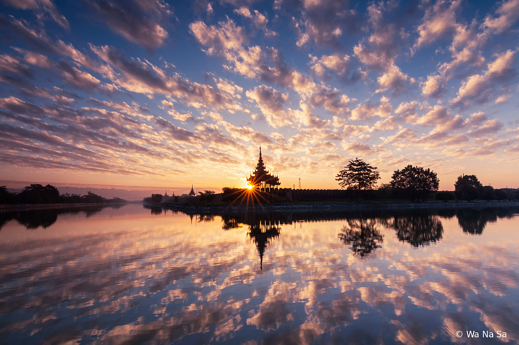 Sunrise over Mandalay Palace.