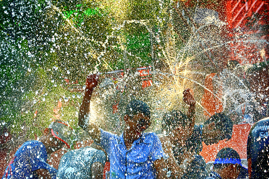 Dancers under the water drops