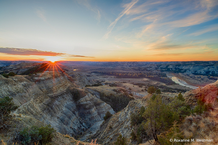 Sun rising over the badlands