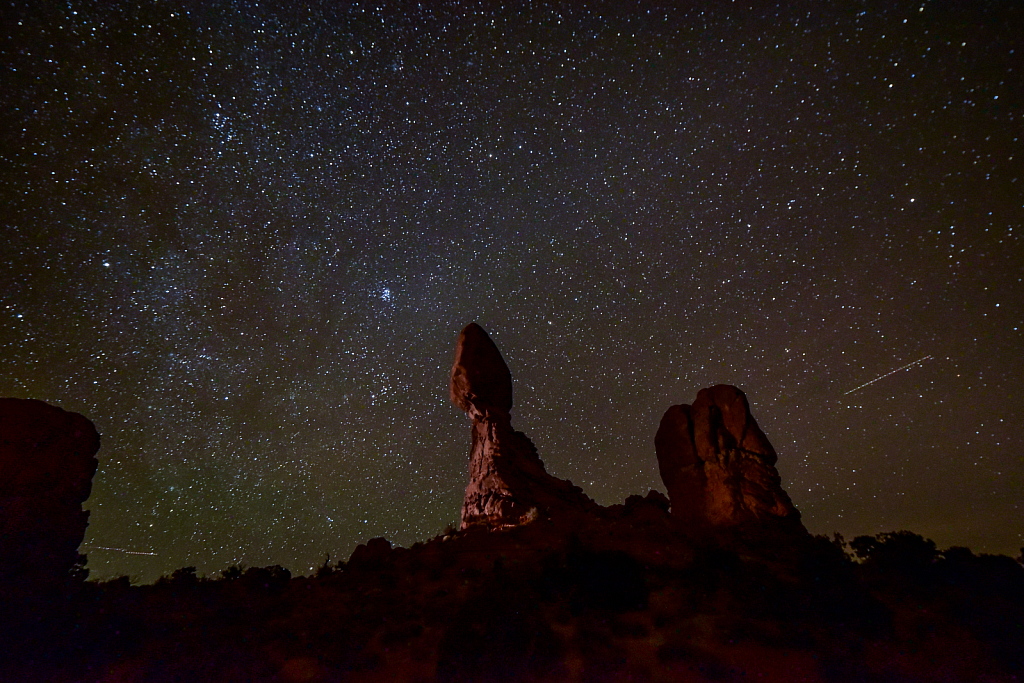 balanced rock at night with milky way