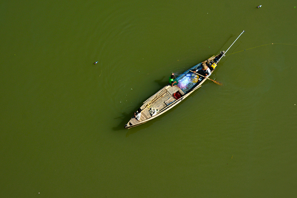 Fisher men in the river