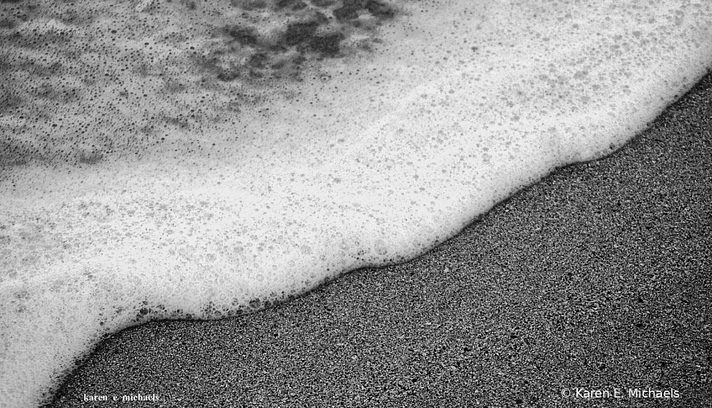 seafoam encroaching on sand - ID: 15786601 © Karen E. Michaels