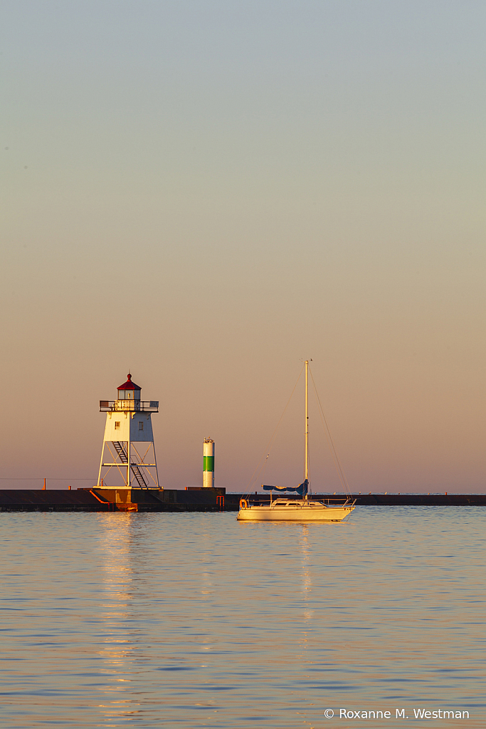 Early morning lighthouse and sailboat - ID: 15811758 © Roxanne M. Westman