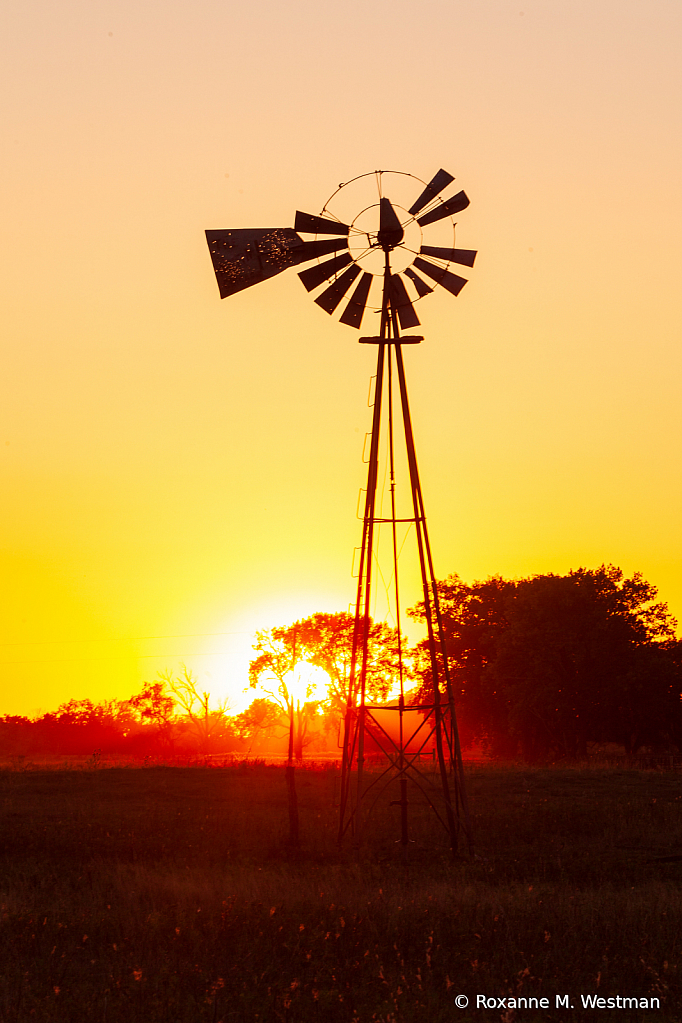 North Dakota windmill at sunset vertical