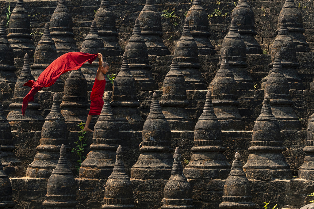 Novice in the middle of pagodas