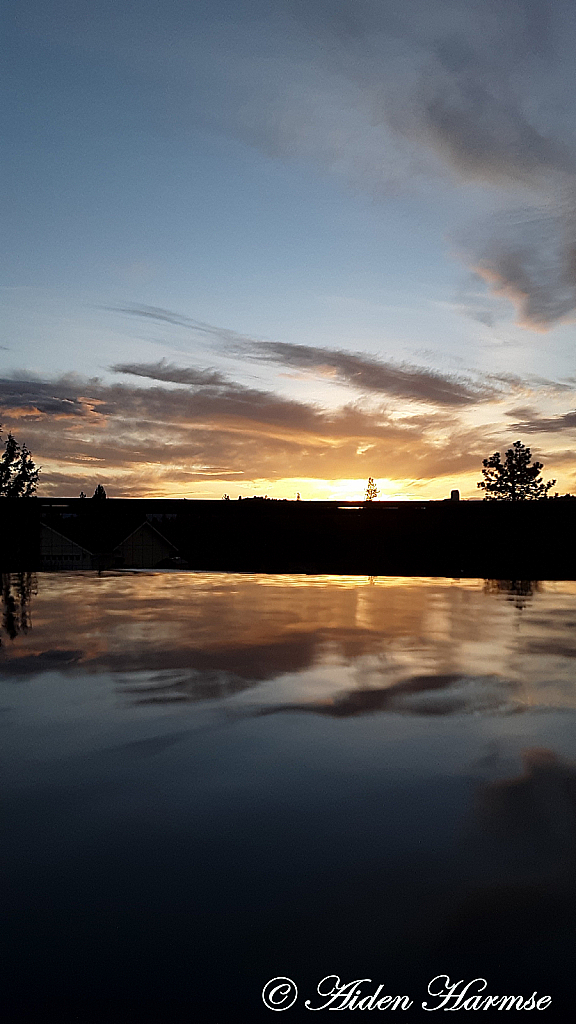 Sunset Over The Puddle