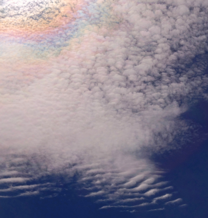 Rainbow colors on the  clouds.