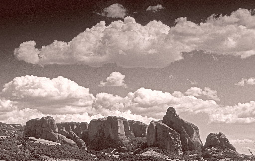Cloud layers over Meteora rocks.