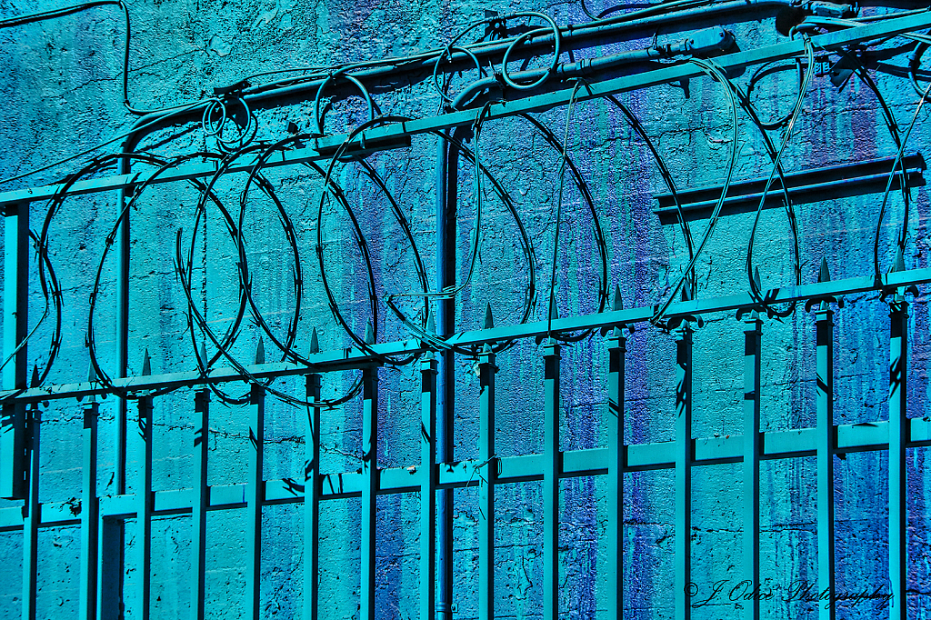 Blue Wall and Barbed Wire