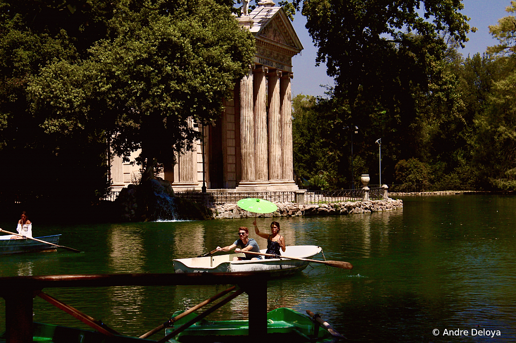 Roman Romance under a green umbrella.