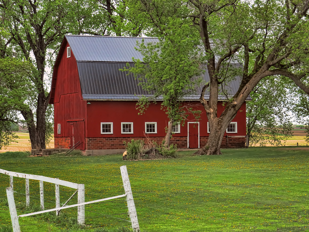 Fence With A Red Barn