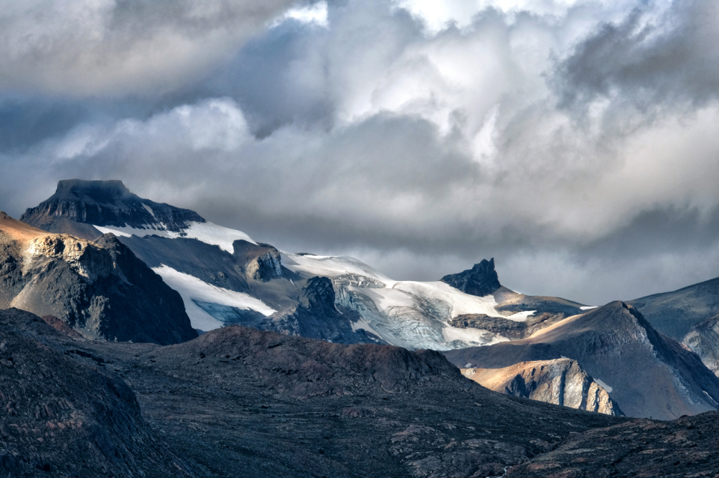 Snow and Glaciers Winding Between Mountains 