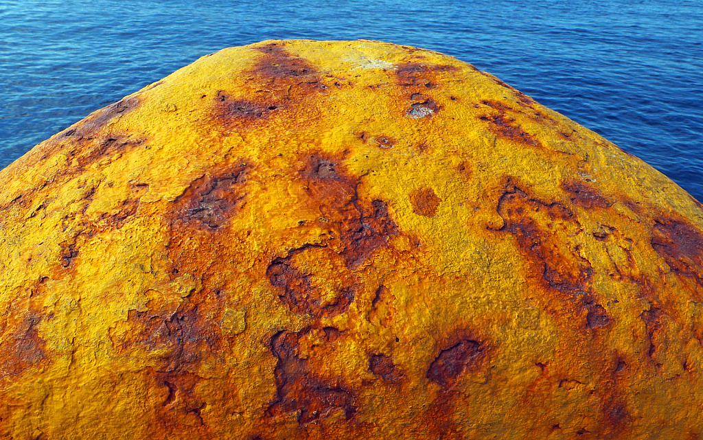 Rust on Bollard pole.