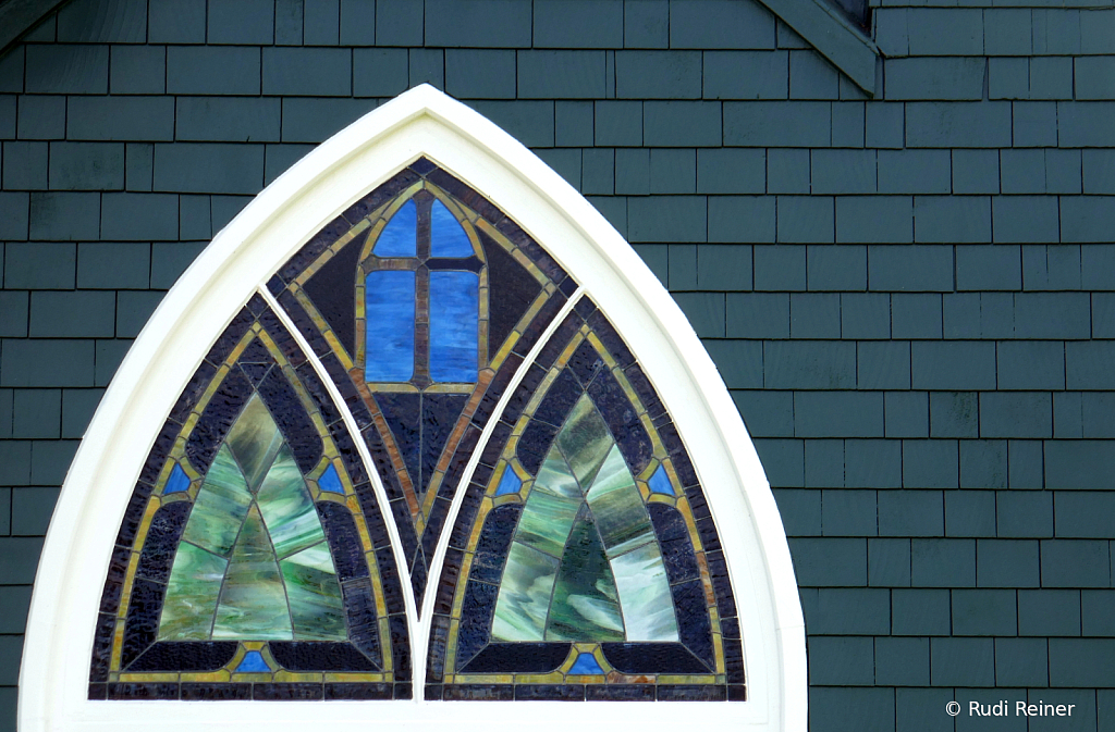 Glasswork above the door