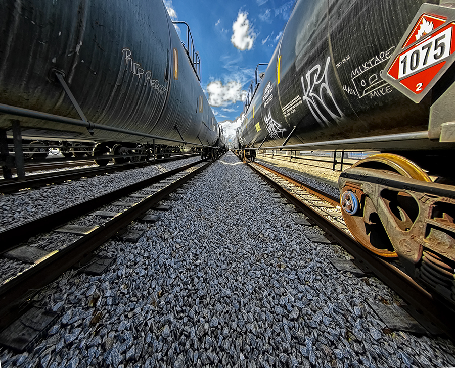 Long View Between the Tank Cars - ID: 16009816 © John D. Jones