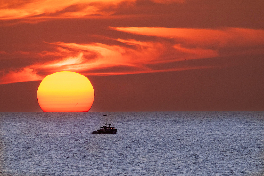 Sunrise and the Fishing Boat