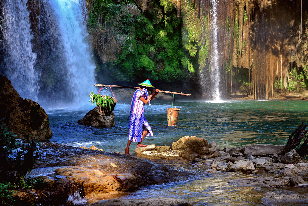 Karen workers and waterfall