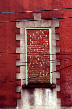 Red Bricked Window in a Red Wall