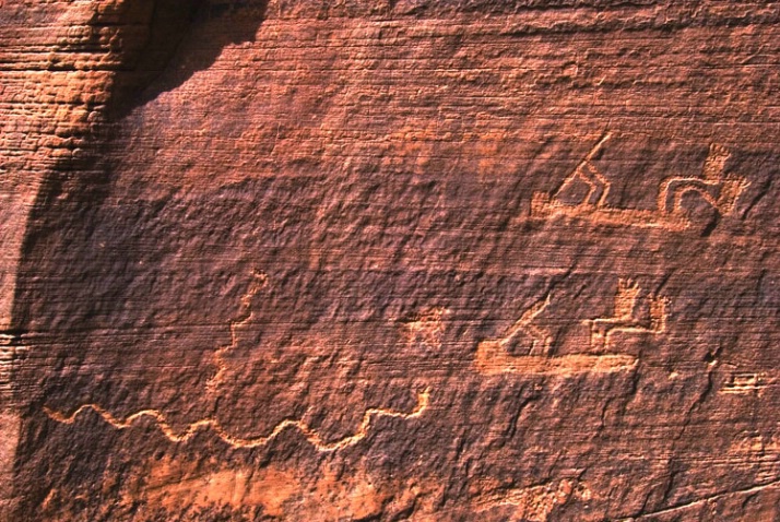 Kokopelli  with snake giving birth