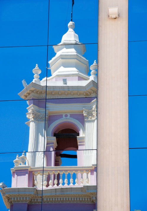 Catedral reflection in mordern building