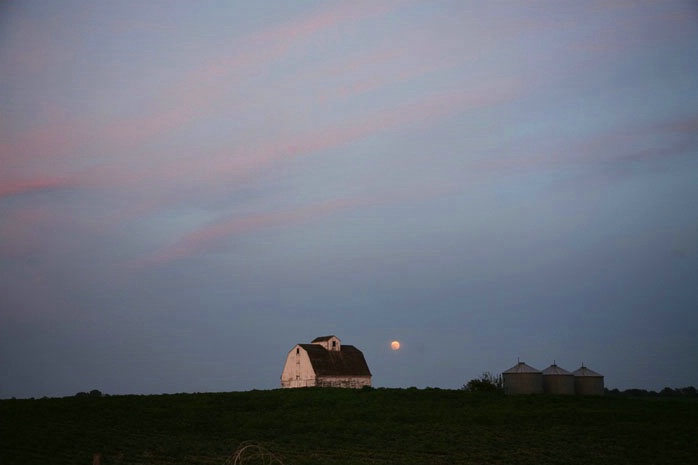 Full moon rising over farmland