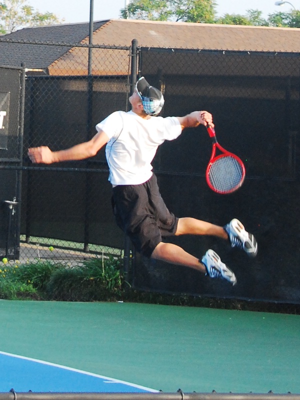 Volleyball serve with a racket