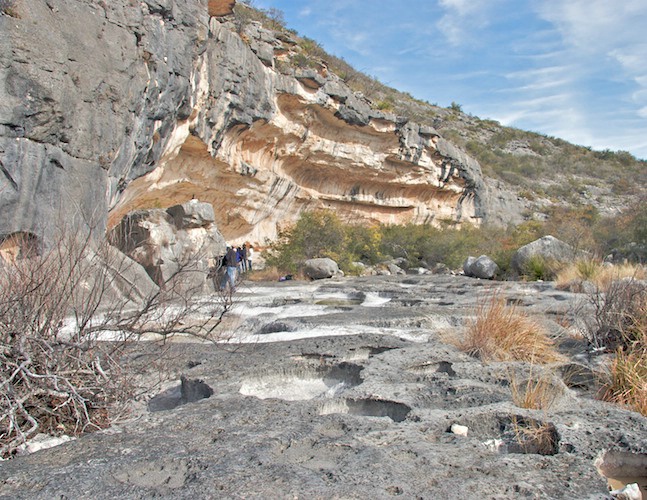 Pools and crevices pock mark the arrival